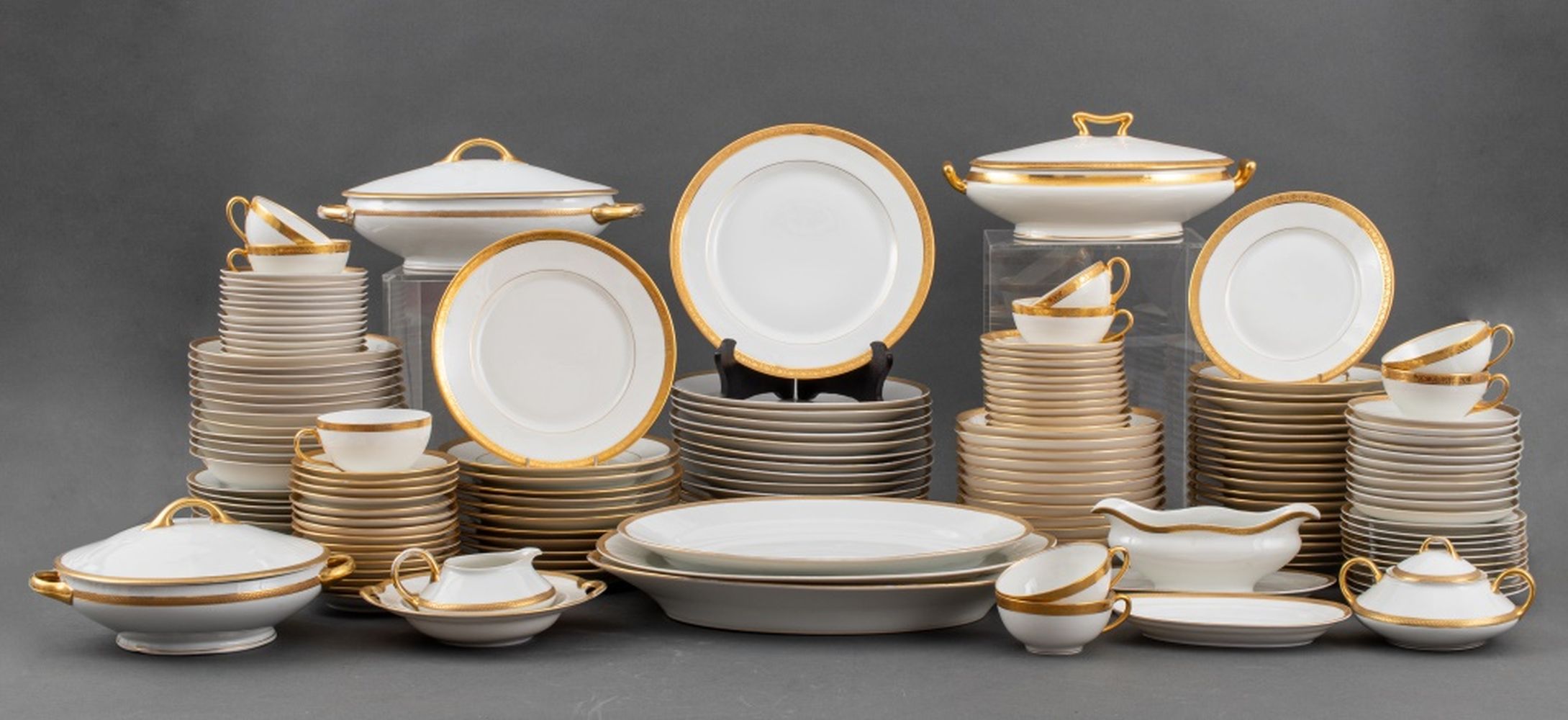 Appraisal: EUROPEAN GILT-EDGED ASSEMBLED PART DINNER SVC European gilt-edged porcelain assembled