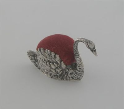 Appraisal: An Edwardian novelty swimming swan pin cushion with textured plumage