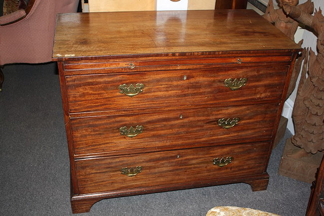 Appraisal: A TH CENTURY MAHOGANY STRAIGHT FRONT CHEST with brushing slide