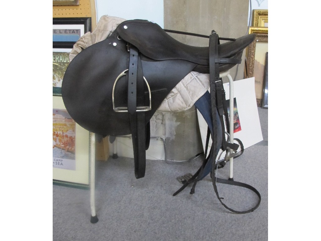 Appraisal: A lot comprising a saddle bridle riding crop on stand