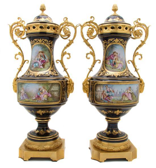 Appraisal: Pair of Sevres Style Gilt Metal Mounted Covered Urns having