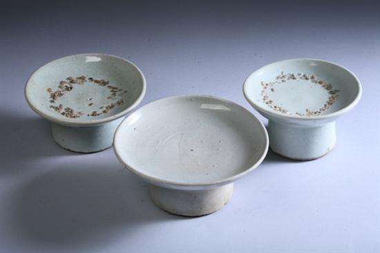 Appraisal: THREE KOREAN LIGHT CELADON PORCELAIN STEM SHALLOW BOWLS Choson period