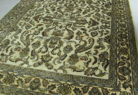 Appraisal: HAND KNOTTED ORIENTAL CARPET Persian floral design on cream ground