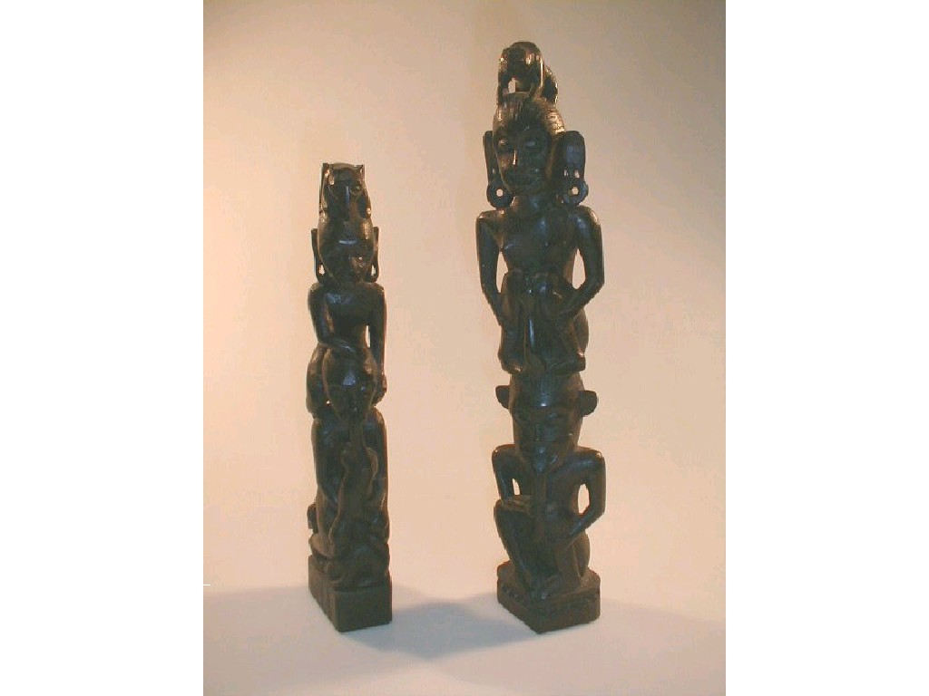 Appraisal: Two Tribal Totem figural carvings and high respectively