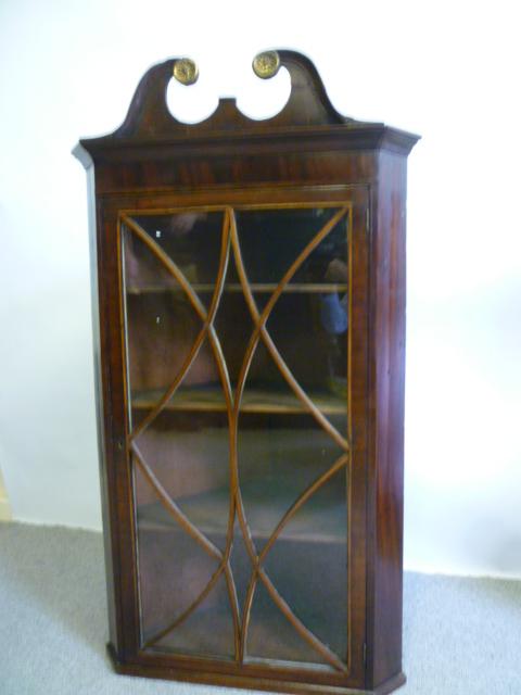 Appraisal: A GEORGE III MAHOGANY HANGING WALL CUPBOARD c the moulded