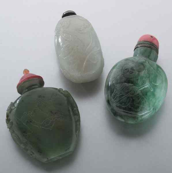 Appraisal: Chinese Qing carved jade snuff bottles depicting plum squash and