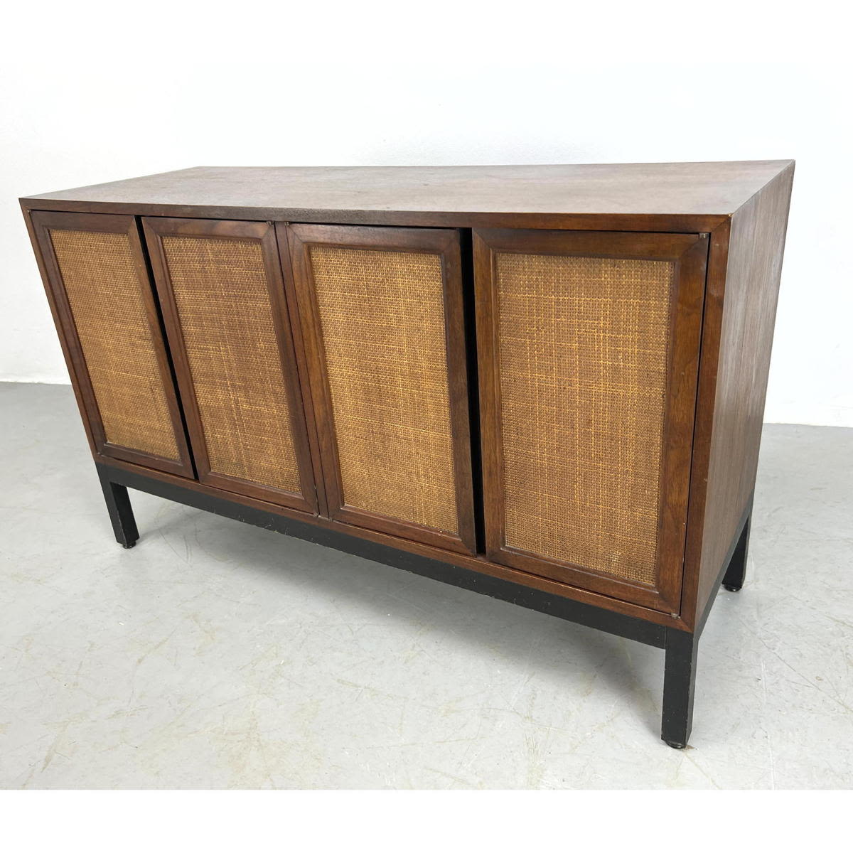 Appraisal: American modern walnut credenza with four cane doors Harvey Probber