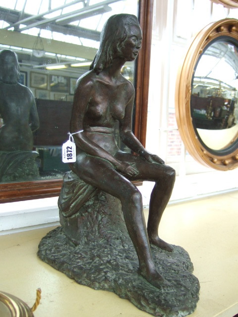 Appraisal: A contemporary bronze composite sculpture modelled as a female nude