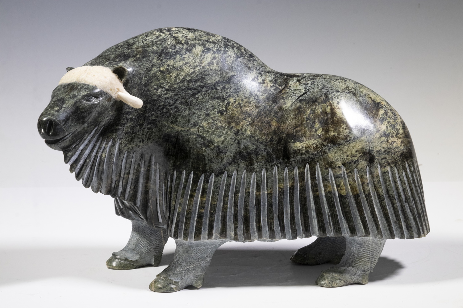 Appraisal: NEWJALEAK QIMIRPIK CANADIAN INUIT CARVING OF A MUSK OX Lake