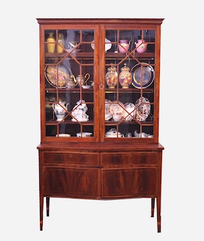 Appraisal: A Mahogany Secretary In two sections the upper portion with