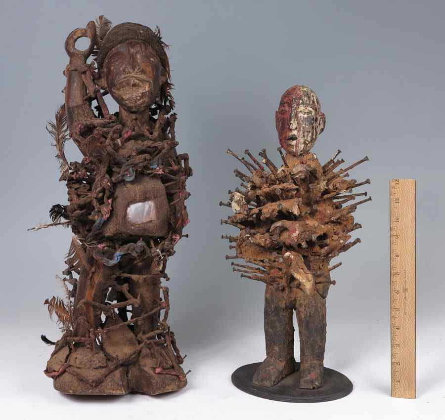 Appraisal: TWO CARVED AFRICAN FETISH FIGURES ''h and ''h CONDITION May