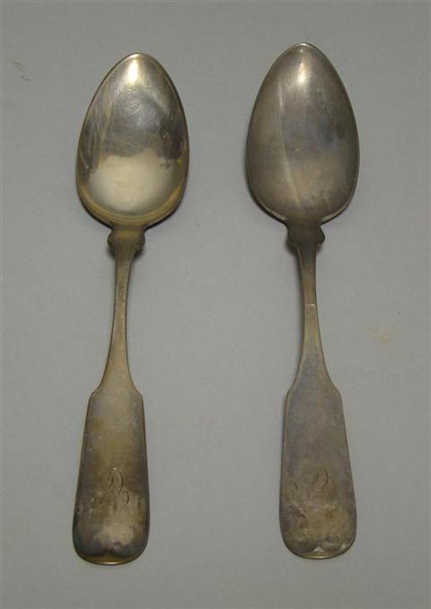 Appraisal: PAIR OF COIN SILVER PLACE SPOONS th century retailed by