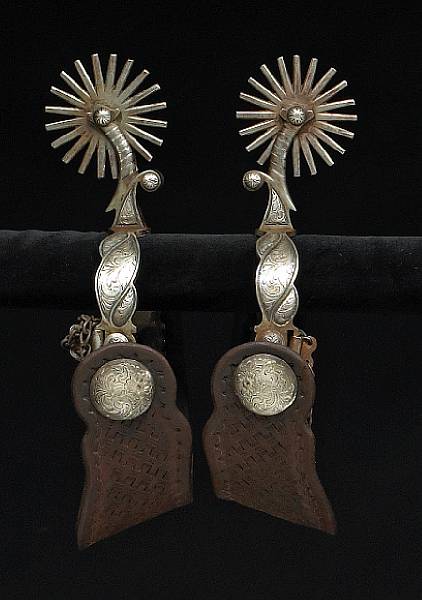 Appraisal: A pair of silver-mounted California style spursprobably by Elmer Miller