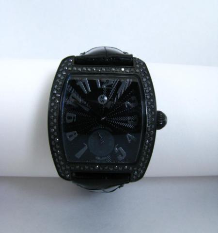 Appraisal: Lady's black diamond bezel tonneau shaped Michele watch with black