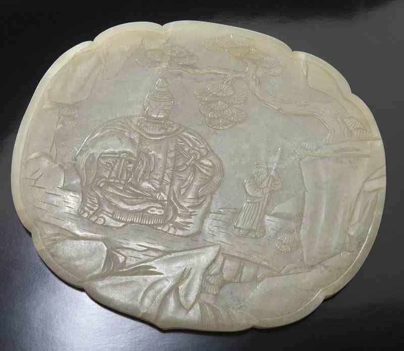 Appraisal: Chinese Qing carved jade plaquedepicting a scholar with an elephant