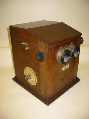 Appraisal: LE TAXIPHOTO STEREOSCOPIC VIEWER the mahogany cabinet with a mechanism