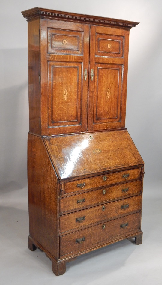 Appraisal: An early thC oak bureau bookcase the top with a