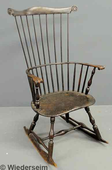 Appraisal: Comb-back Windsor rocker with carved knuckle arm supports and shaped