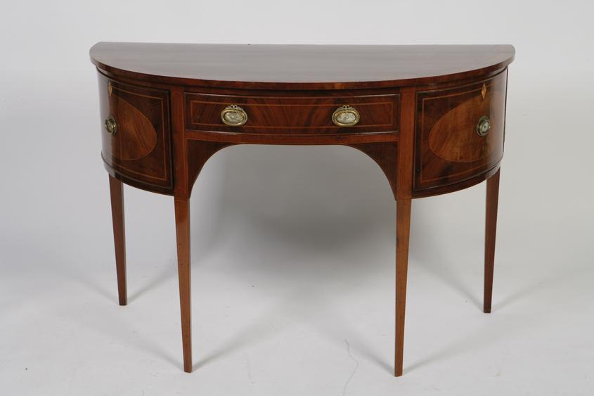 Appraisal: A REGENCY MAHOGANY D -SHAPED SIDE TABLE the shaped top