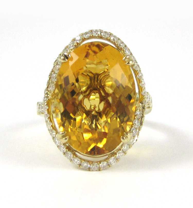 Appraisal: CITRINE DIAMOND AND FOURTEEN KARAT GOLD RING with round-cut diamonds