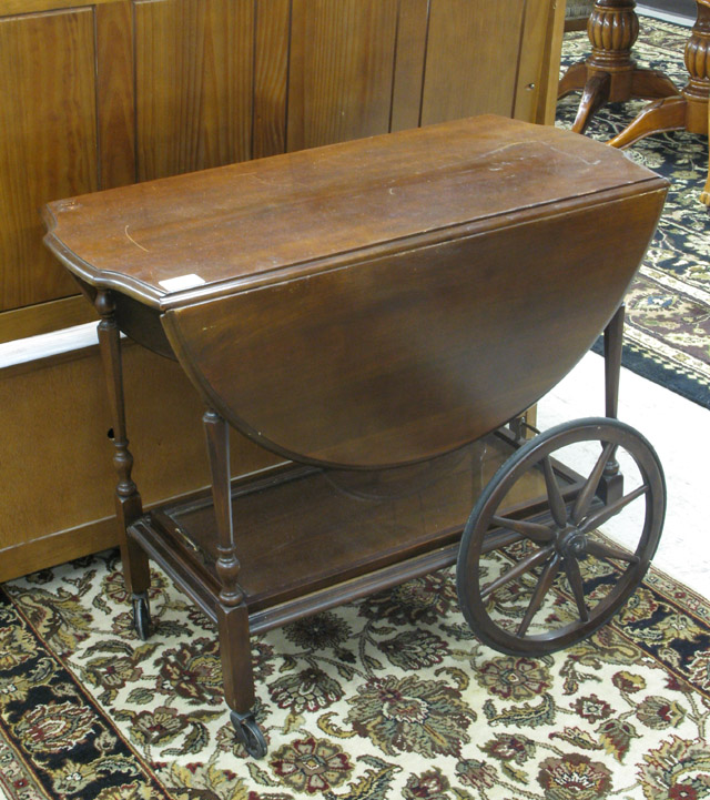 Appraisal: DROP-LEAF WALNUT TEACART American c 's having a rectangular top