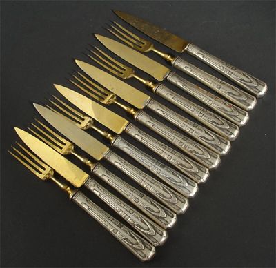 Appraisal: A set of six electroplated cake knives and forks with