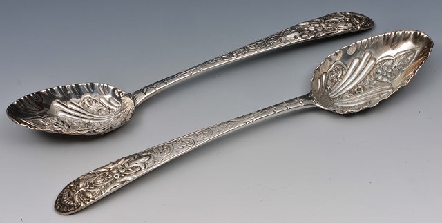 Appraisal: Pair of Irish silver spoonswith embossed bowls and relief handles