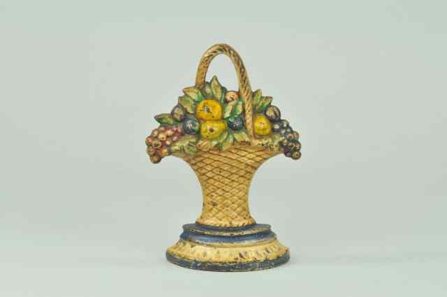 Appraisal: FRUIT BASKET DOORSTOP Cast iron unusual highly detailed casting of