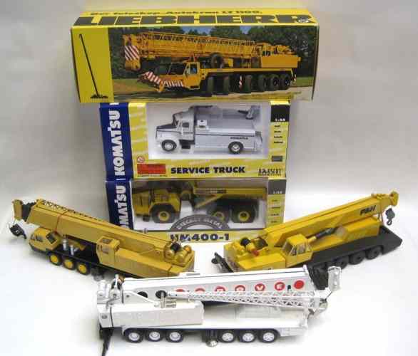 Appraisal: SIX DIECAST SCALE MODELS OF HEAVY EQUIPMENT NZG Grove cranes