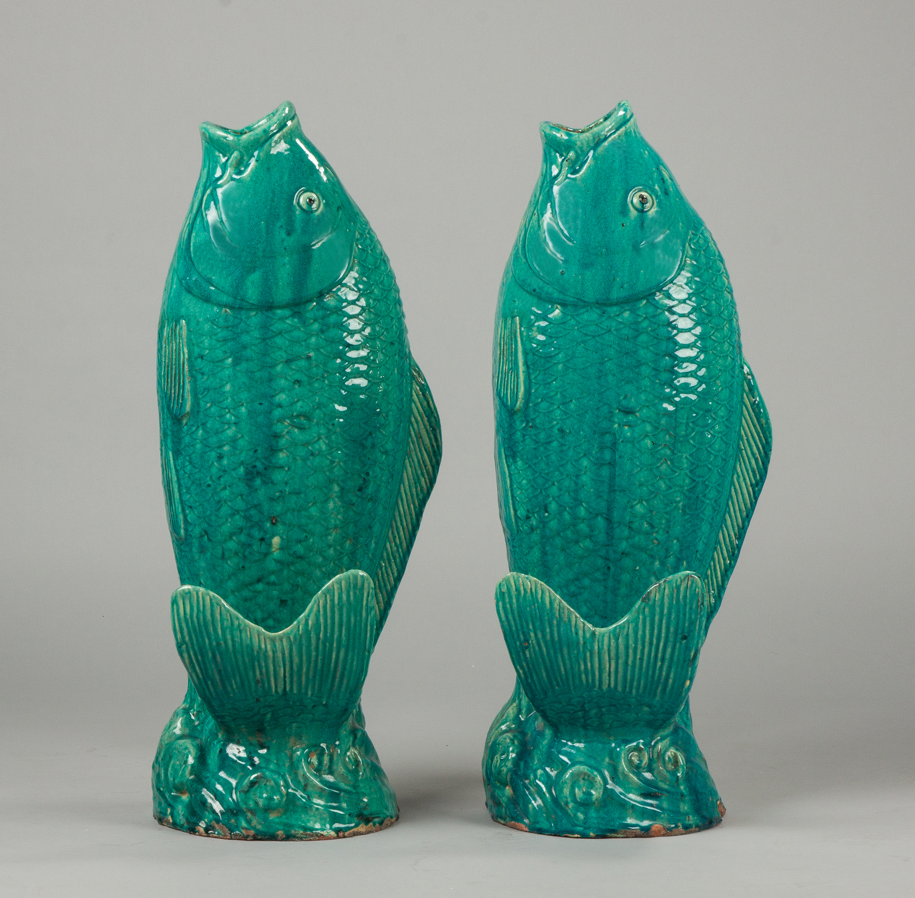 Appraisal: Two Blue Glazed Terracotta Fish Early th cent