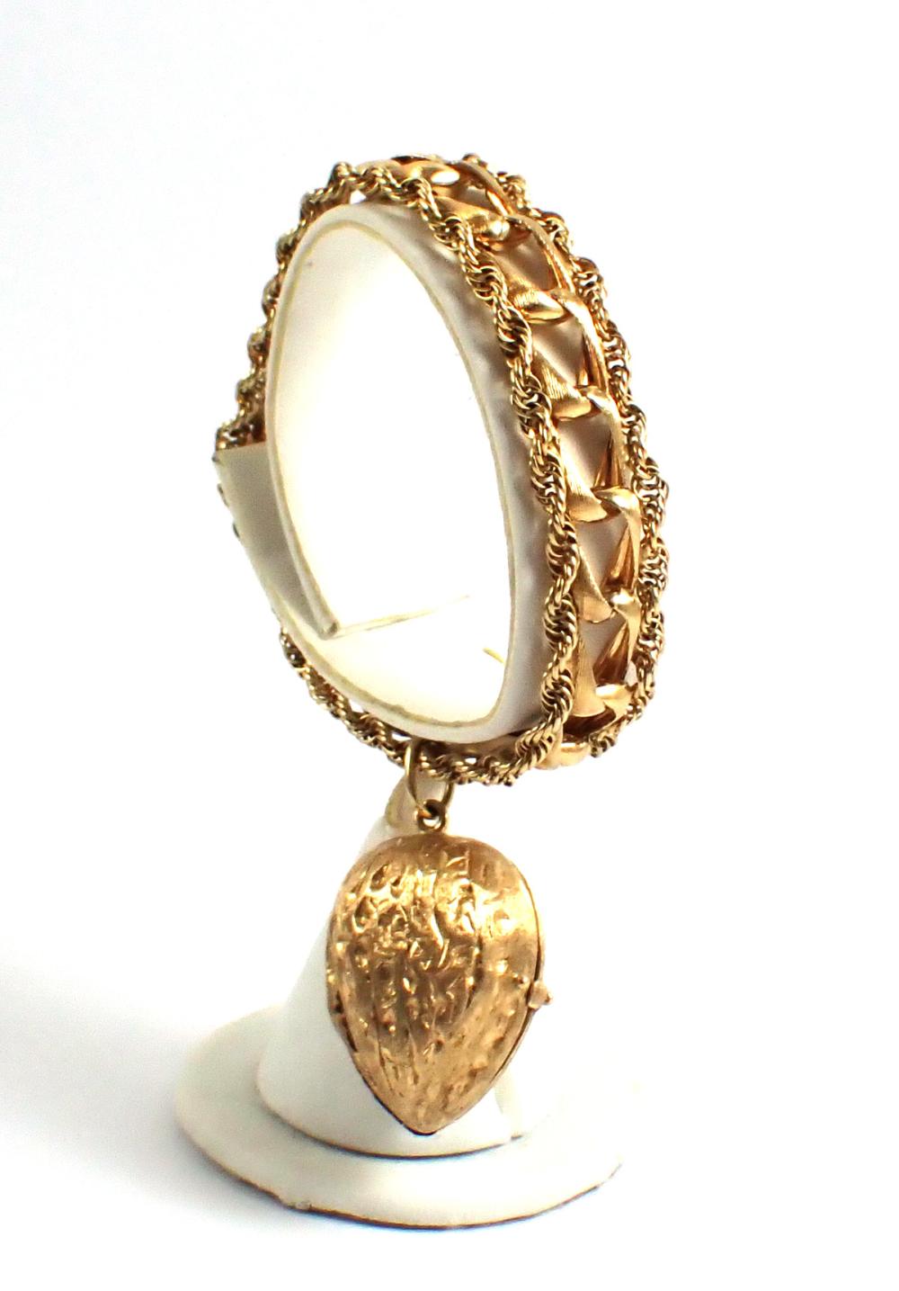 Appraisal: FOURTEEN KARAT GOLD BRACELET WITH LOCKET The - k yellow