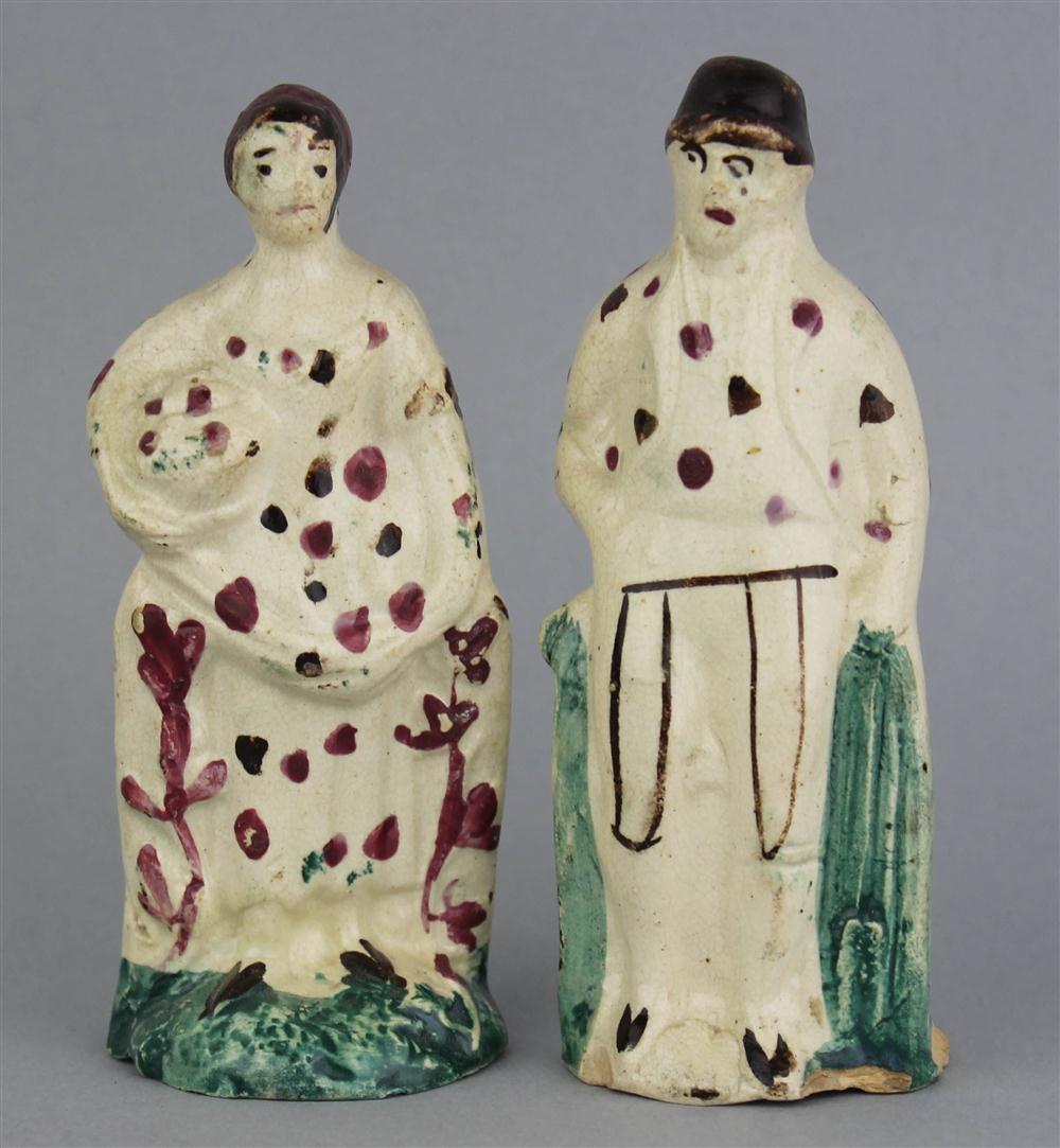 Appraisal: TWO SMALL ENGLISH PEARLWARE FIGURES OF GARDENERS she holding a