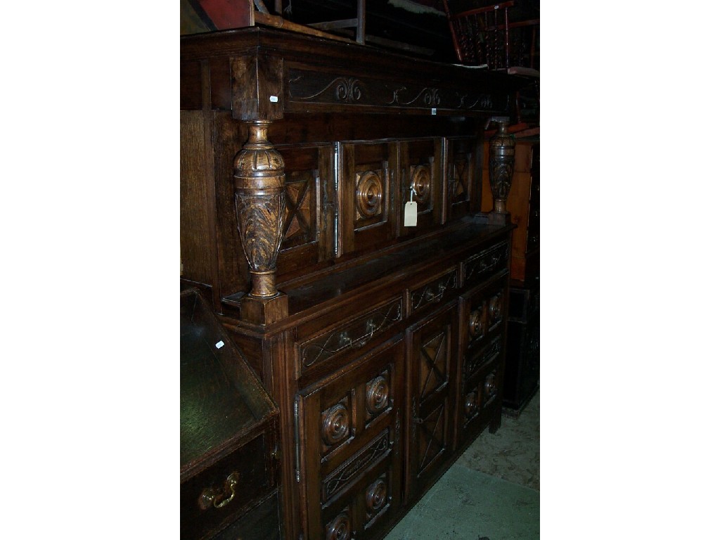 Appraisal: A substantial oak -tier court cupboard the upper section fitted