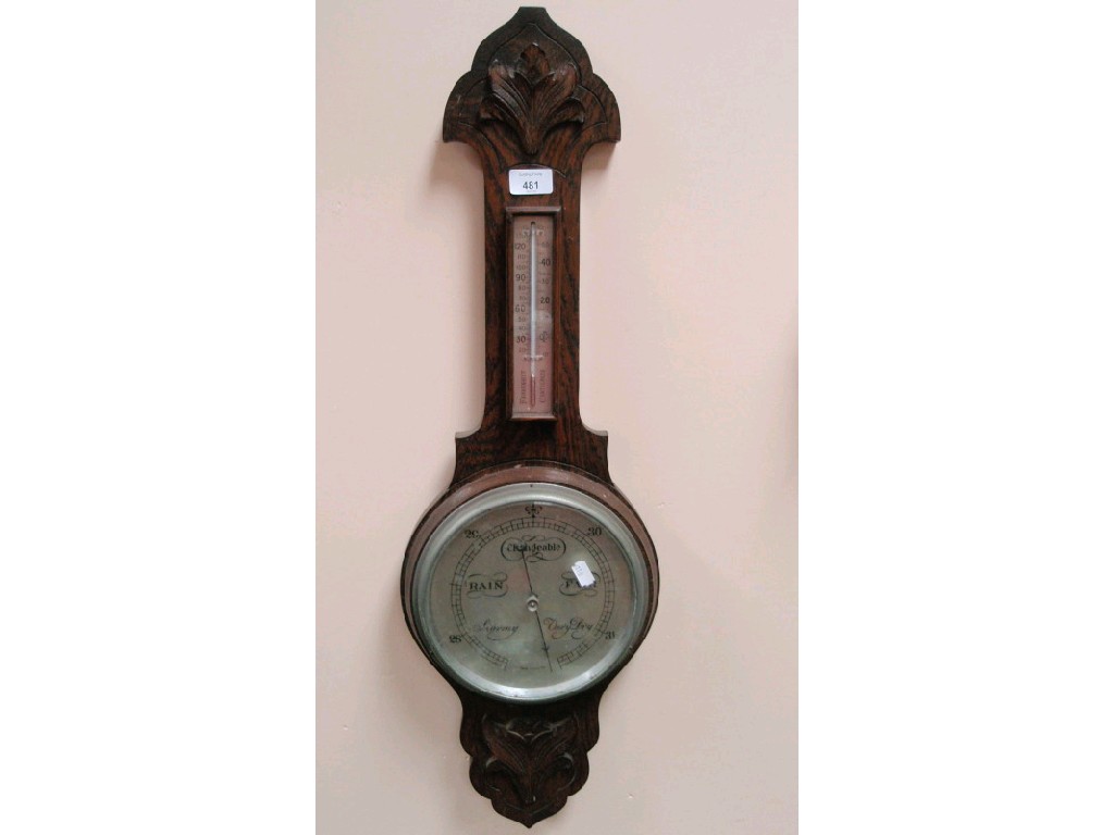 Appraisal: A 's carved oak aneroid wheel barometer