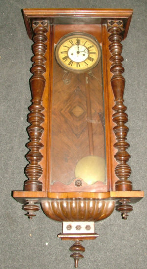 Appraisal: An early th century walnut cased Vienna regulator type wall