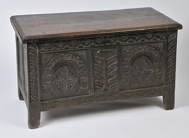 Appraisal: A TH CENTURY CARVED OAK COFFER with carved front and