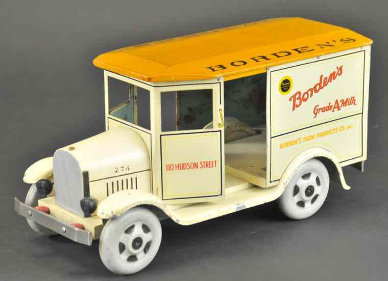 Appraisal: BORDEN'S MILK WAGON Rich Toys scarce example lithographed tin and