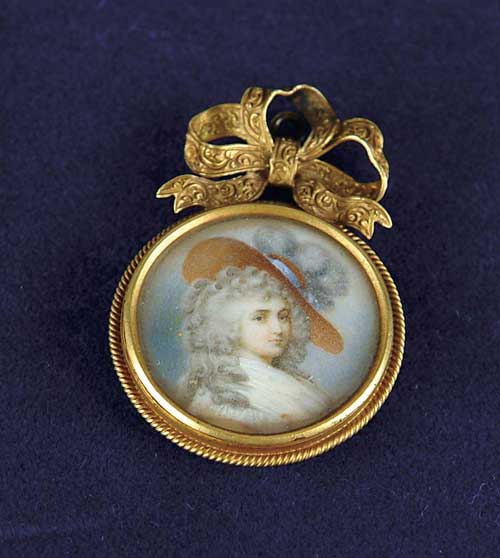 Appraisal: MINIATURE ROUND PORTRAIT LOCKET Round locket has portrait of elegant