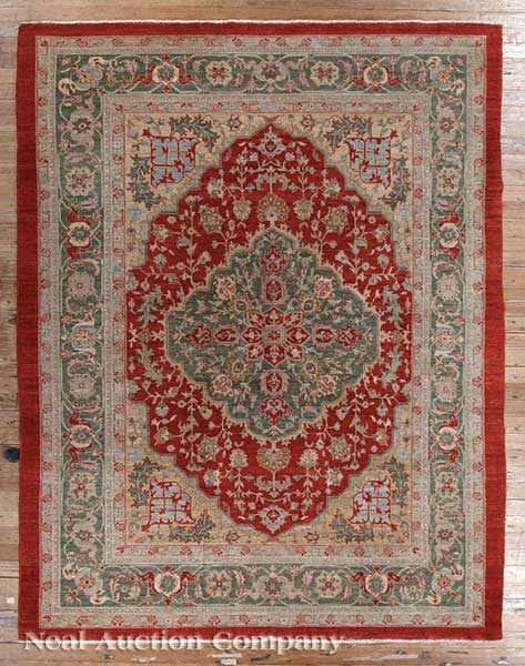 Appraisal: A Persian Carpet rust and green ground central medallion with