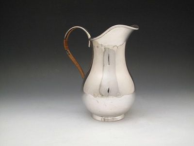 Appraisal: A late-Victorian silver water jug by Norton and While Birmingham