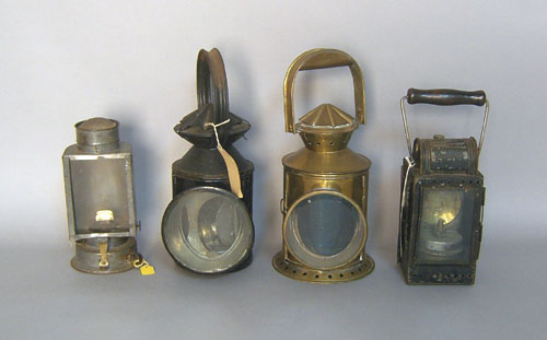 Appraisal: Four tin and brass carry lanterns th c tallest -