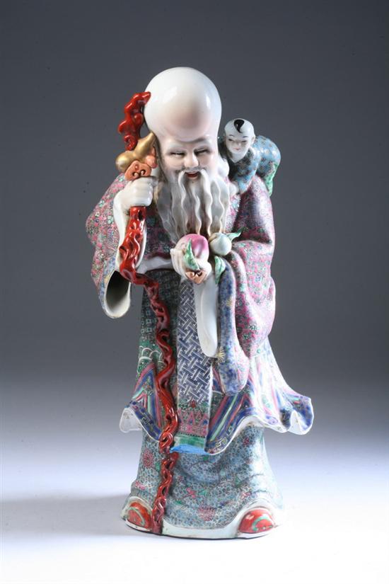 Appraisal: CHINESE FAMILLE ROSE PORCELAIN FIGURE OF SHOUXING Standing holding peach