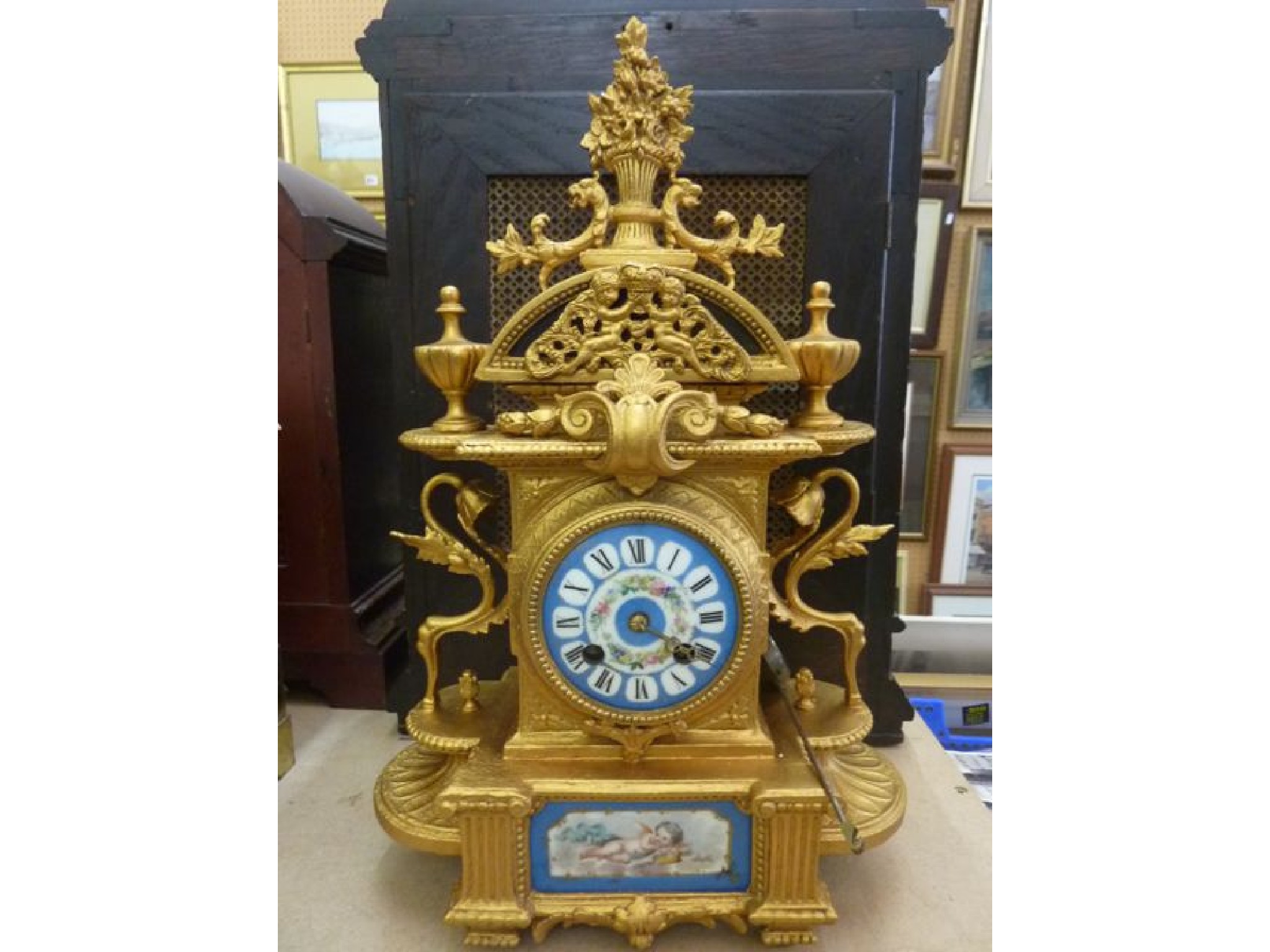 Appraisal: A th century mantle clock with gilded case porcelain dial