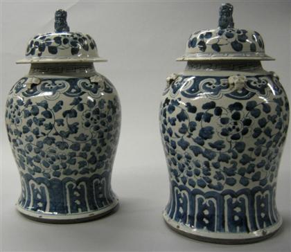 Appraisal: Pair of blue and white covered jarsDomed cover with Fu