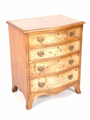 Appraisal: A walnut serpentine chest circa of four graduated drawers upon