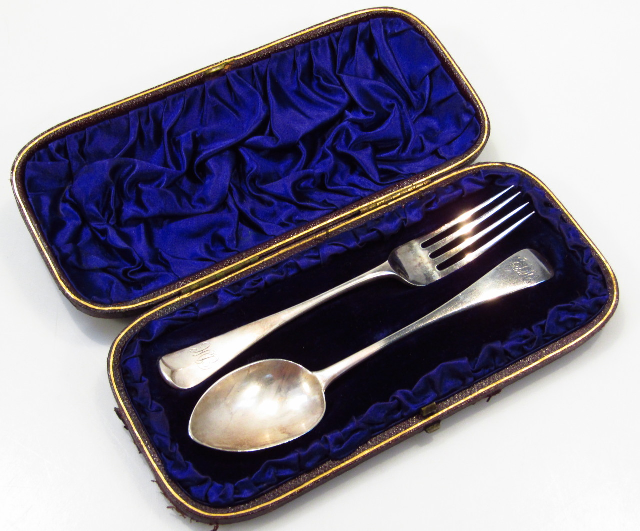 Appraisal: Victorian silver christening set comprising spoon and fork Old English