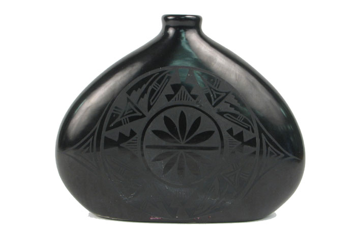 Appraisal: A NAVAJO BLACK-ON-BLACK POTTERY JUG with stylized design on one