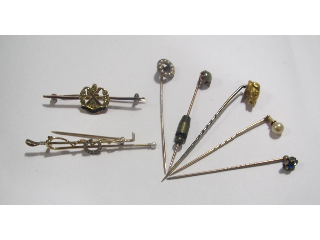 Appraisal: Lot comprising five stick pins with various tops to include