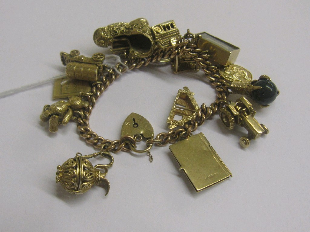 Appraisal: Nine carat gold charm bracelet with various ct gold charms