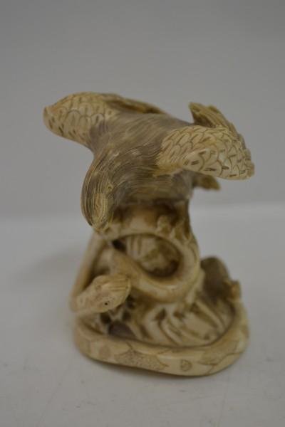 Appraisal: IVORY CARVING EAGLE AND SNAKE